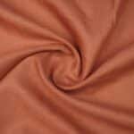 Emerald by Burgoyne rust shade pure linen fabric now available at The Fashion Fabric